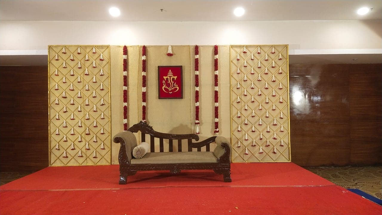 Golden Acoustic Panel Stage with Wooden Loveseat
